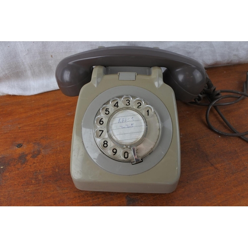 450 - A vintage rotary dial telephone.