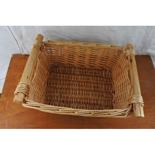 453 - A wicker two handled basket.