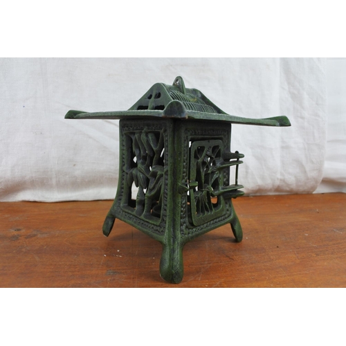 520 - A cast iron Chinese style tealight lantern.