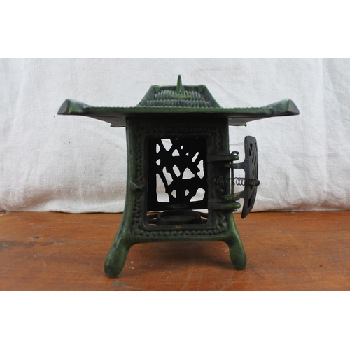 520 - A cast iron Chinese style tealight lantern.