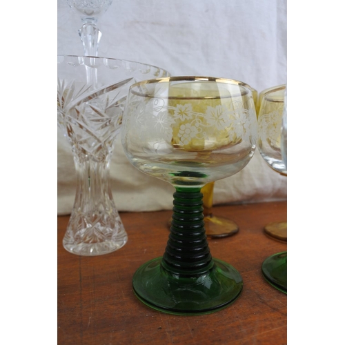 524 - A stunning set of six vintage green stemmed wine glasses, a set of four large amber glass goblets an... 