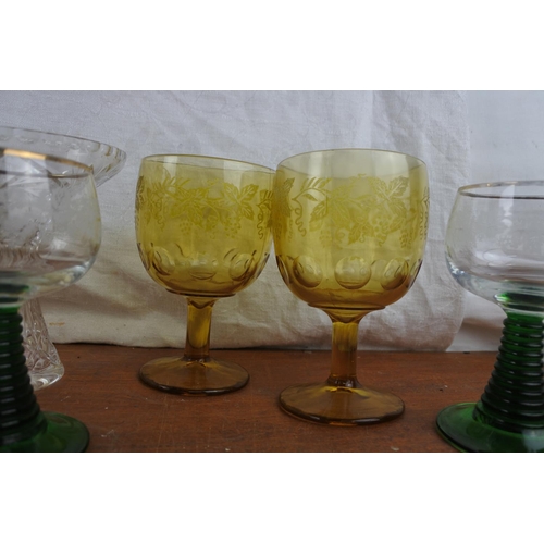 524 - A stunning set of six vintage green stemmed wine glasses, a set of four large amber glass goblets an... 