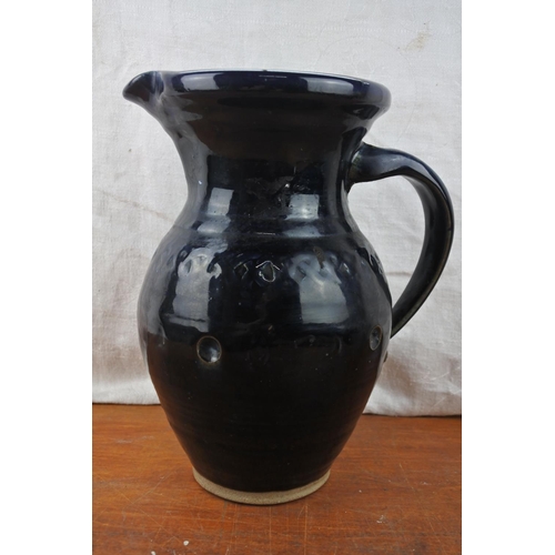 559 - A large Irish 'Celtic Clays' pottery jug.