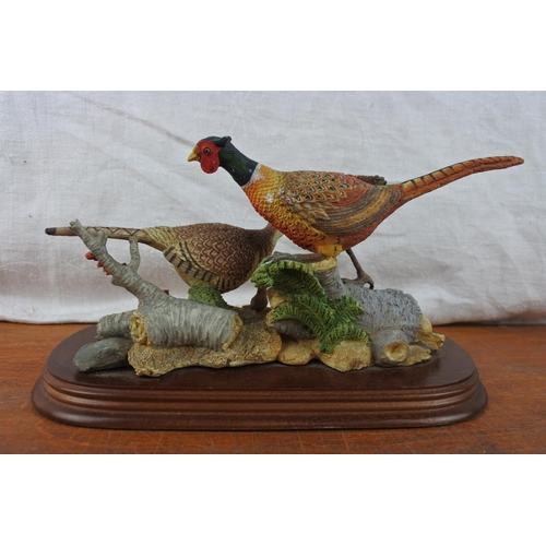 565 - A mounted Leonardo ornament of pheasants.