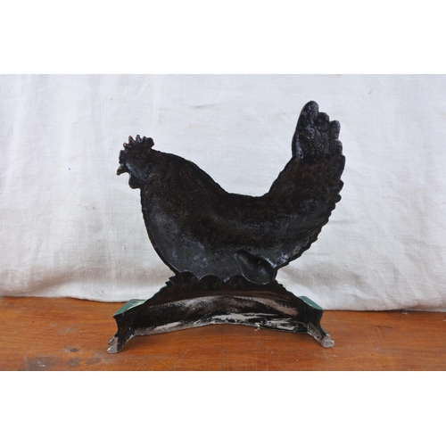 571 - A large hen cast iron doorstop