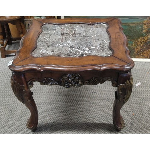 72 - A stunning mahogany occasional table with carved detail and a marble effect top, measuring 26