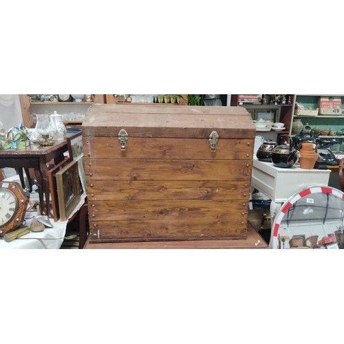 179 - A large dome shaped wooden storage trunk, measuring 36