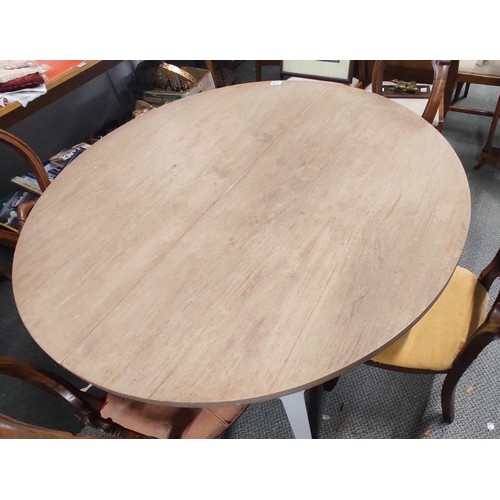 230 - A large circular dining table with painted base, measuring 50