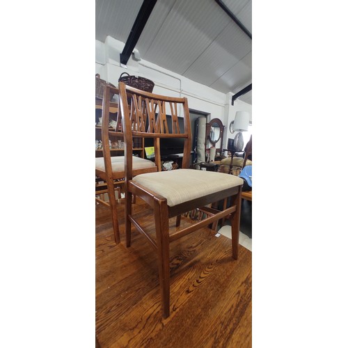 235 - A vintage/ Mid Century Teak drop leaf dining table with set of 6 matching chairs, measuring 58