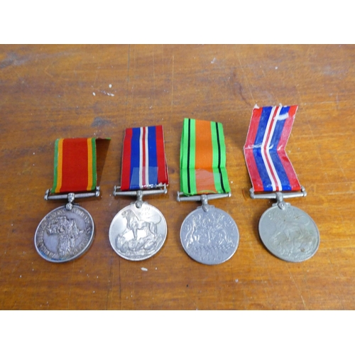 20 - A collection of four medals to include a King George IV inscribed 232625 J.J. Britz and another un-s... 