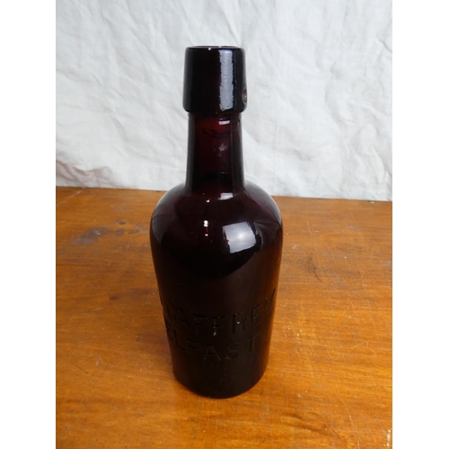 31 - An antique brown glass T.R. Caffrey, Belfast beer bottle.