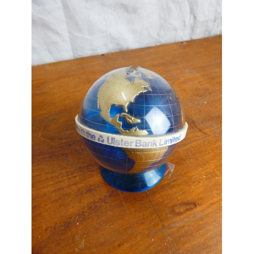 33 - A vintage Ulster Bank Limited globe of the world money box.