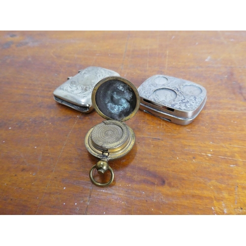 18 - An antique silver plated vesta case, an antique gold plated sovereign holder and another antique nic... 
