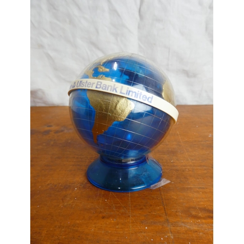 33 - A vintage Ulster Bank Limited globe of the world money box.