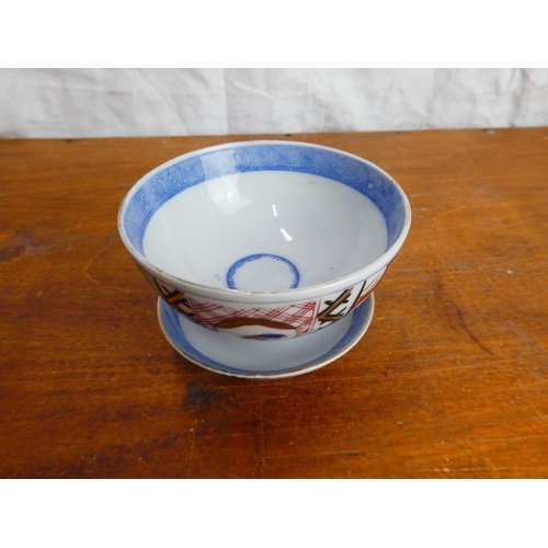 44 - A vintage Chinese/ Oriental porcelain tea bowl and saucer.