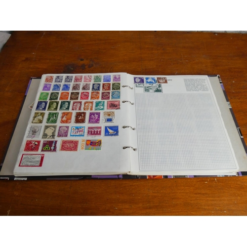 50 - An Stanley Gibbons 'Swiftsure' stamp album and contents (countries A - J).