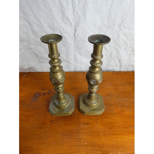 4 - A pair of brass candlesticks.