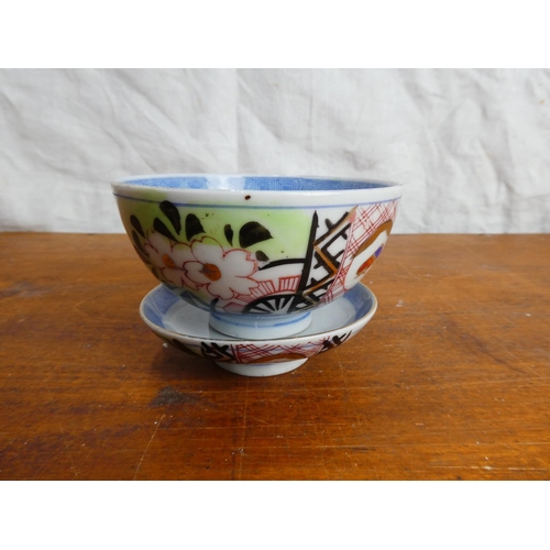 44 - A vintage Chinese/ Oriental porcelain tea bowl and saucer.