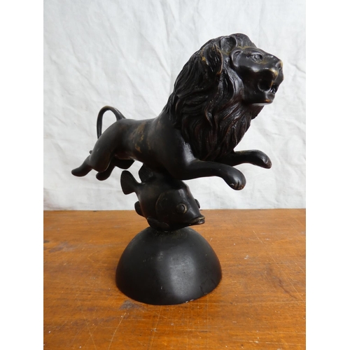 45 - An unusual heavy metal figure of a lion on fish.