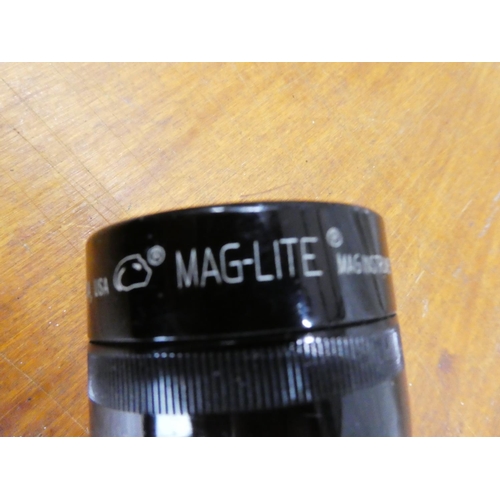 52 - A Mag-Lite torch measuring 10
