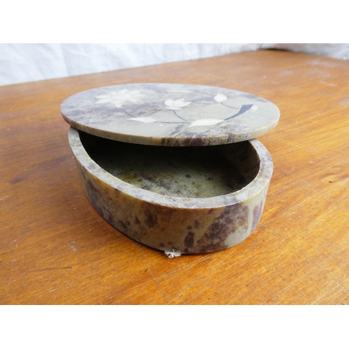 53 - A marble and mother of pearl trinket box.