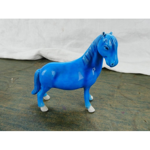 102 - A Highland Arts glazed pottery figure of a horse.