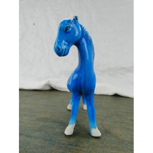 102 - A Highland Arts glazed pottery figure of a horse.