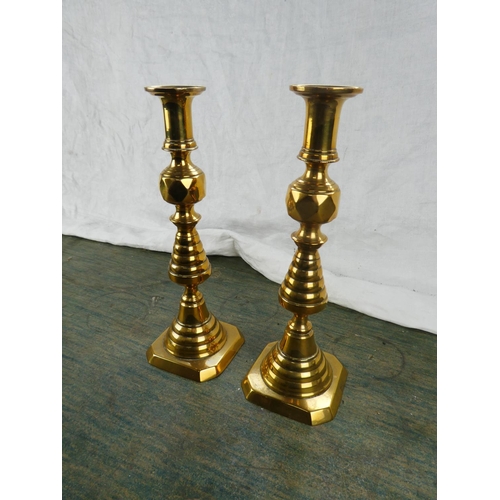 123 - A large pair of antique brass candlesticks stamped RD223580.