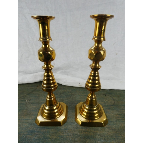 123 - A large pair of antique brass candlesticks stamped RD223580.