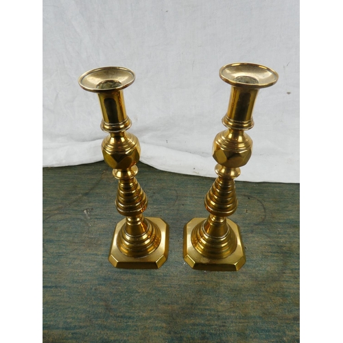 123 - A large pair of antique brass candlesticks stamped RD223580.