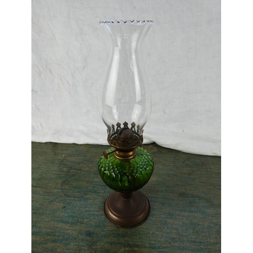 130 - A small green glass oil lamp.