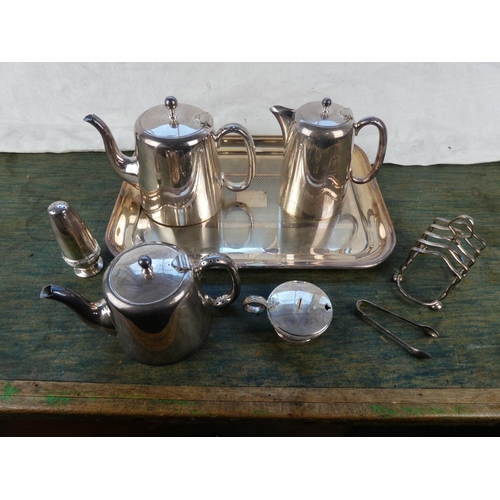 135 - A vintage silver plated serving tray, toast rack, coffee pots and more.