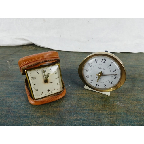 136 - A vintage Smiths alarm clock and case and a vintage Westclox 'Baby Ben' alarm clock.