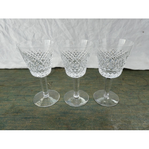 147 - Three Waterford Crystal wine glasses.