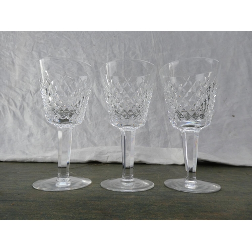 147 - Three Waterford Crystal wine glasses.