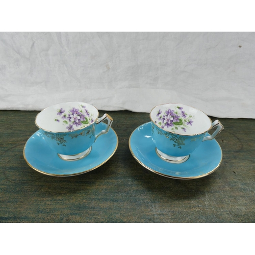 154 - Two Aynsley cabinet cups and saucers.