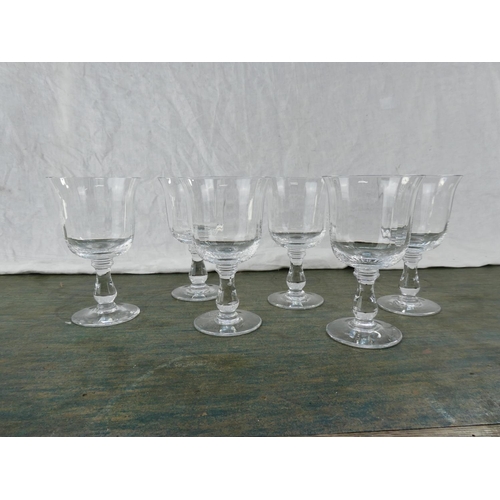 160 - A set of six tulip shaped wine glasses.