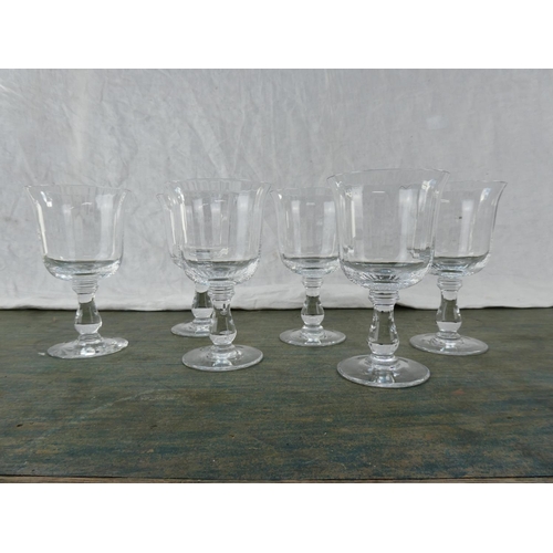 160 - A set of six tulip shaped wine glasses.