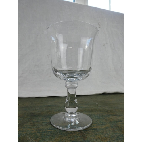 160 - A set of six tulip shaped wine glasses.