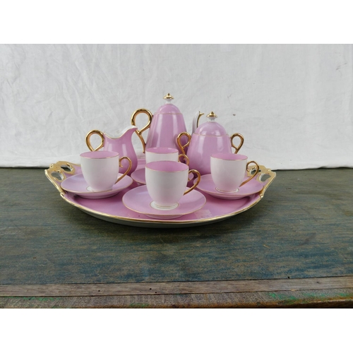 164 - A stunning vintage ceramic pink tea service with gilt detail.