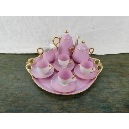 164 - A stunning vintage ceramic pink tea service with gilt detail.