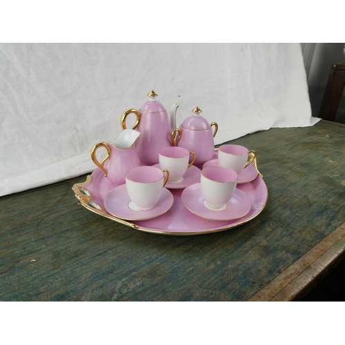 164 - A stunning vintage ceramic pink tea service with gilt detail.