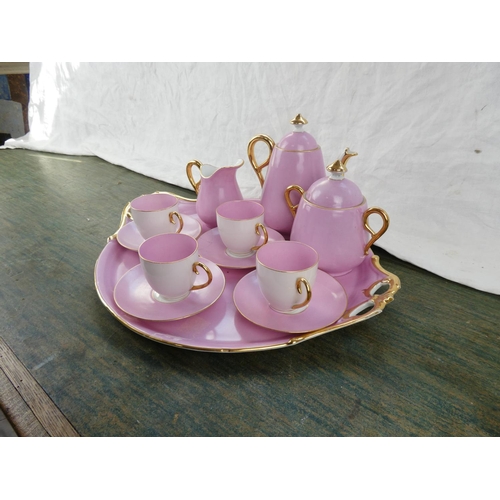 164 - A stunning vintage ceramic pink tea service with gilt detail.