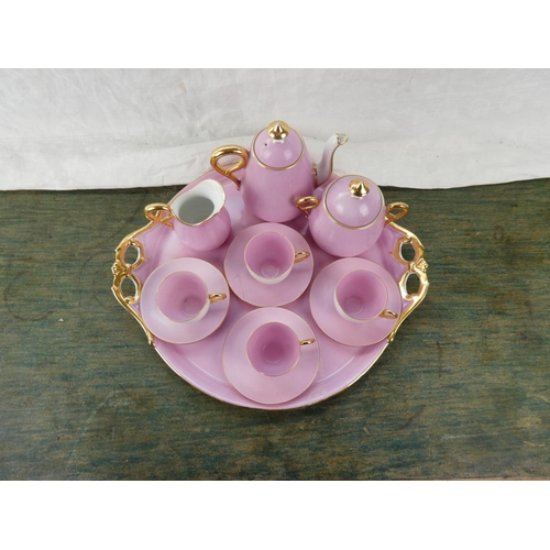 164 - A stunning vintage ceramic pink tea service with gilt detail.