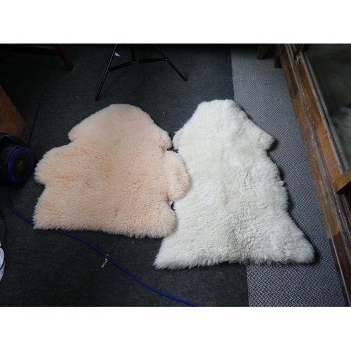 168 - Two vintage sheepskin rugs.