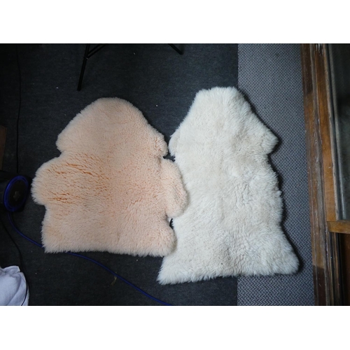 168 - Two vintage sheepskin rugs.