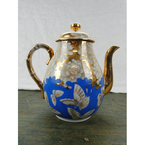 189 - A stunning blue and gilt ceramic teapot.