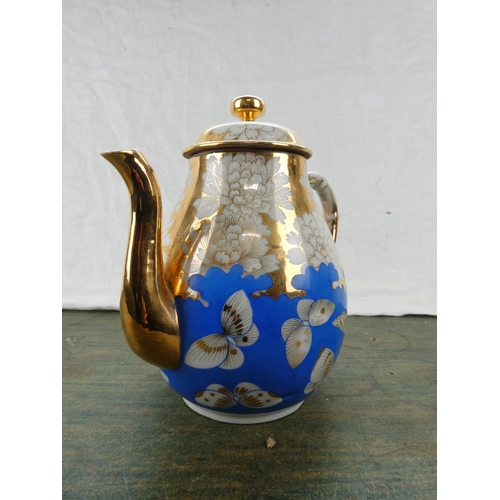 189 - A stunning blue and gilt ceramic teapot.