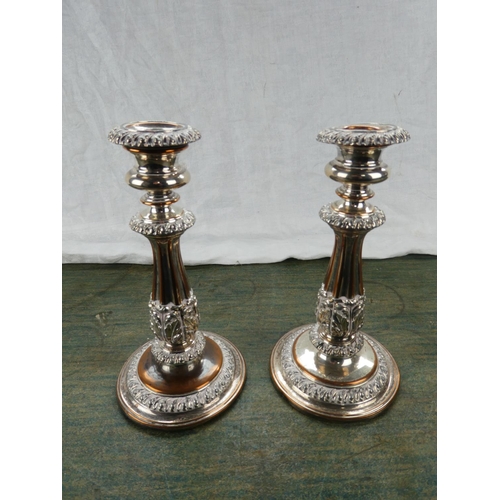 62 - A pair of gilt metal candlesticks.