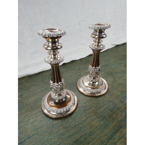 62 - A pair of gilt metal candlesticks.